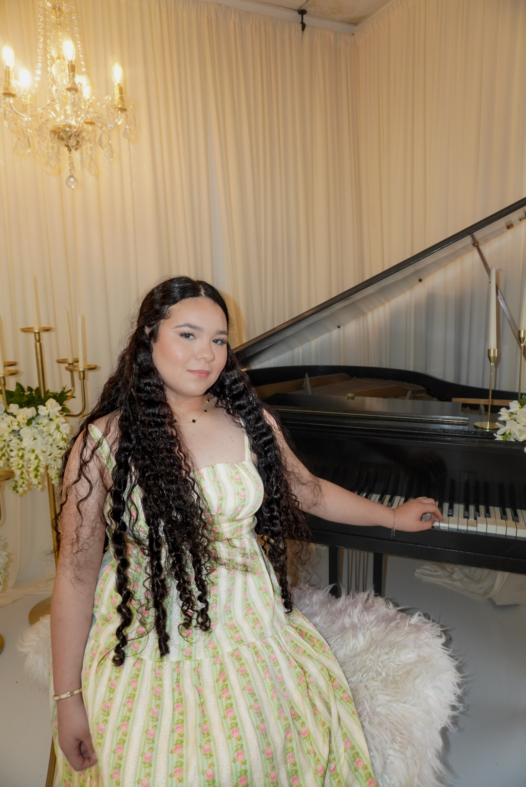 Katherine beside a piano